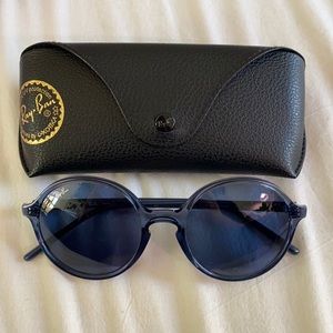 Round blue Ray-Bans.